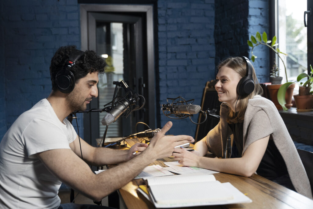 man-woman-running-podcast-together-studio